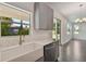 Well-appointed kitchen with quartz countertops, farmhouse sink, and stainless steel appliances at 1530 W River Shore Way, Tampa, FL 33603