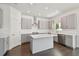 Stylish kitchen featuring gray shaker cabinets, a stainless steel range hood, and sleek countertops at 1530 W River Shore Way, Tampa, FL 33603