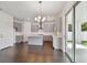 Modern kitchen with gray cabinets, large island, and stainless steel appliances at 1530 W River Shore Way, Tampa, FL 33603