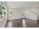Bright living room with large windows and dark wood floors at 1530 W River Shore Way, Tampa, FL 33603