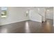 Spacious living room with hardwood floors and white walls, ready for your personal touch at 1530 W River Shore Way, Tampa, FL 33603