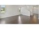 Spacious living room with hardwood floors and ample natural light from large windows at 1530 W River Shore Way, Tampa, FL 33603