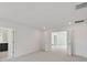 Large main bedroom with carpeted floors, white walls, and double doors to ensuite bathroom at 1530 W River Shore Way, Tampa, FL 33603