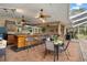 Outdoor kitchen with bar seating, and dining area at 1730 Harmony Dr, Clearwater, FL 33756