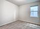 Bright bedroom with a window and neutral decor at 19231 Mossy Pine Dr, Tampa, FL 33647