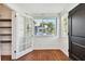 Front entry with hardwood floors and view into kitchen at 2230 6Th N Ave, St Petersburg, FL 33713