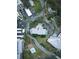 Aerial view showing condo building, landscaping, and parking at 3 Seaside Ln # 601, Belleair, FL 33756
