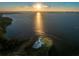 Aerial view of waterfront golf course at sunset at 3 Seaside Ln # 601, Belleair, FL 33756