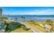 Aerial view of waterfront property with pool and lush landscaping at 3 Seaside Ln # 601, Belleair, FL 33756