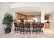 Wet bar has seating, decorative lighting, ample cabinet space, and a great location near living areas at 3 Seaside Ln # 601, Belleair, FL 33756