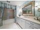 Clean bathroom with a vanity, bathtub, and decorative window treatment at 3 Seaside Ln # 601, Belleair, FL 33756