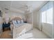 Spacious bedroom with a comfortable bed and large windows at 3 Seaside Ln # 601, Belleair, FL 33756