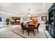 Breakfast nook features a round table, chandelier, and open floor plan at 3 Seaside Ln # 601, Belleair, FL 33756
