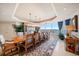 Elegant dining room features a large table, scenic views, and stylish decor at 3 Seaside Ln # 601, Belleair, FL 33756