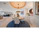 Bright dining room with round table and white chairs at 3 Seaside Ln # 601, Belleair, FL 33756