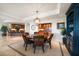 Formal dining room with round table and elegant chandelier at 3 Seaside Ln # 601, Belleair, FL 33756