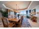 Large dining room with a water view, chandelier, and custom decor at 3 Seaside Ln # 601, Belleair, FL 33756
