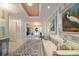 Inviting hallway with elegant decor, including paintings, a bench, and a stylish rug at 3 Seaside Ln # 601, Belleair, FL 33756
