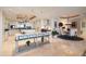 Spacious open concept kitchen featuring marble floors, custom island, and a breakfast nook at 3 Seaside Ln # 601, Belleair, FL 33756