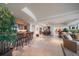 Open concept living and dining areas with seating at the bar and marble floors at 3 Seaside Ln # 601, Belleair, FL 33756