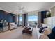 Comfortable living room with stylish furniture, decorative curtains, and water views at 3 Seaside Ln # 601, Belleair, FL 33756