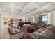 Open concept living room with high ceilings, grand piano, comfortable seating, and abundant natural light at 3 Seaside Ln # 601, Belleair, FL 33756
