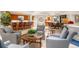 Expansive living area with a bar, multiple seating areas, and views into other rooms at 3 Seaside Ln # 601, Belleair, FL 33756