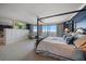 Main bedroom features a king-size bed and stunning water views at 3 Seaside Ln # 601, Belleair, FL 33756