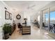 Home office with built-in desk, water view, and hardwood floors at 3 Seaside Ln # 601, Belleair, FL 33756