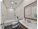Updated bathroom with subway tile shower and marble vanity at 3210 39Th S St # C, St Petersburg, FL 33711