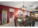 Well-lit dining room adjacent to the kitchen and living room at 3954 Sailmaker Ln, Holiday, FL 34691