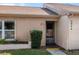 View of the home's entrance with a manicured lawn and walkway at 3954 Sailmaker Ln, Holiday, FL 34691