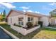 Side view of a single story home showcasing its neat landscaping at 3954 Sailmaker Ln, Holiday, FL 34691