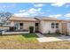 Front view of charming single-story home with well-maintained landscaping at 3954 Sailmaker Ln, Holiday, FL 34691