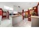 Kitchen boasts a large island, granite countertops, and ample cabinet space at 3954 Sailmaker Ln, Holiday, FL 34691