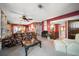 Living room with a view into the dining area and access to other rooms at 3954 Sailmaker Ln, Holiday, FL 34691