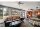 Sunroom with comfortable seating and access to the backyard at 3954 Sailmaker Ln, Holiday, FL 34691