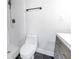 Modern bathroom with gray vanity and hexagon floor tiles at 4511 Helena Ne St, St Petersburg, FL 33703