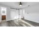 Bright bedroom featuring a stylish barn door and updated bathroom at 4511 Helena Ne St, St Petersburg, FL 33703
