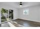 Bright bedroom with new flooring, sliding doors, and view at 4511 Helena Ne St, St Petersburg, FL 33703