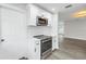 Modern kitchen featuring updated appliances and white cabinets at 4511 Helena Ne St, St Petersburg, FL 33703