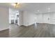 Open living room with new flooring and kitchen view at 4511 Helena Ne St, St Petersburg, FL 33703