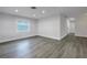 Bright living room with gray vinyl plank flooring at 4511 Helena Ne St, St Petersburg, FL 33703