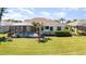 Backyard with screened-in pool and lush green lawn at 5556 Sabal Trace Dr, North Port, FL 34287