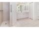Clean bathroom with a shower, ample cabinet space, and neutral finishes, offering a practical and functional design at 5556 Sabal Trace Dr, North Port, FL 34287