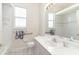 Well-lit bathroom with modern fixtures and towel rack at 5556 Sabal Trace Dr, North Port, FL 34287