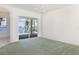 Serene bedroom with sliding glass doors that offer stunning views of the pool and the lake at 5556 Sabal Trace Dr, North Port, FL 34287