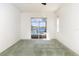 Bright, comfortable bedroom with a picturesque view of the lake and pool through sliding glass doors at 5556 Sabal Trace Dr, North Port, FL 34287