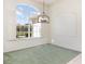 Formal dining area bathed in natural light with a stylish chandelier and plantation shutters at 5556 Sabal Trace Dr, North Port, FL 34287