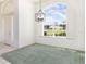Formal dining area featuring a large window and a view to the home's exterior at 5556 Sabal Trace Dr, North Port, FL 34287